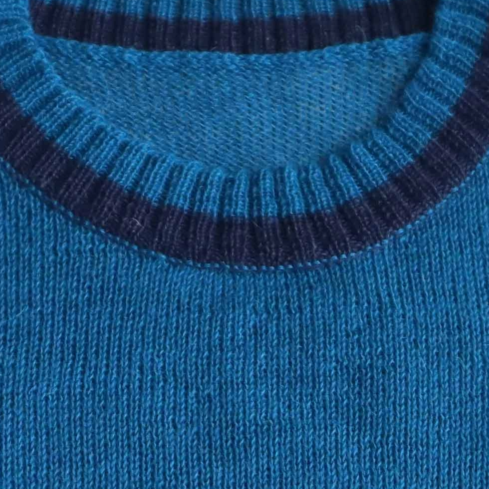 Women's sleeveless sweater 100% royal alpaca color blue with stripes. Made in Peru by PFL knitwear Women's sleeveless sweater 100% royal alpaca color blue with stripes. Made in Peru by PFL knitwear