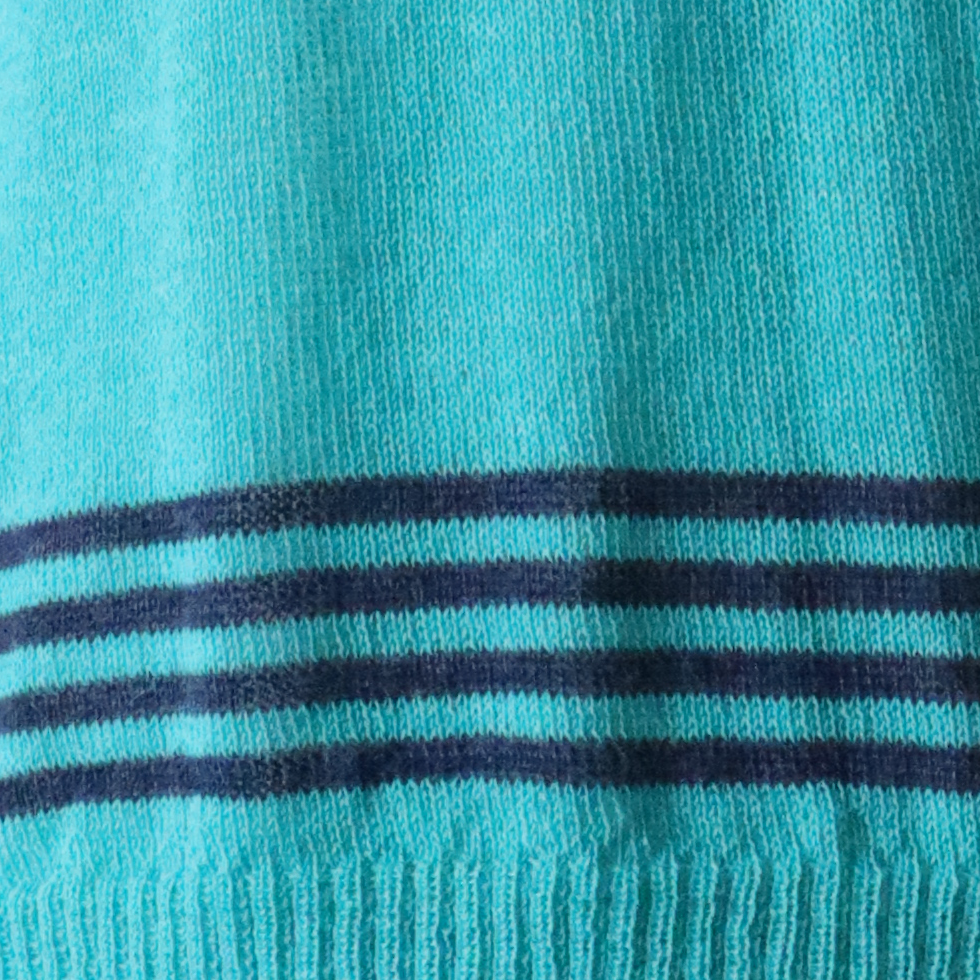 Women's sweater, with V-neck and contrasting stripes at the bottom edge. Made in Peru by PFL knitwear Women's sweater, with V-neck and contrasting stripes at the bottom edge. Made in Peru by PFL knitwear
