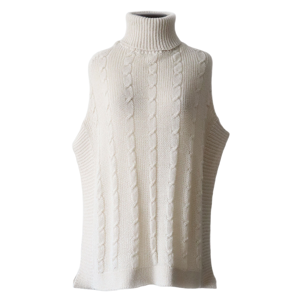 Poncho with a classic cable pattern baby alpaca or alpaca blend. Made in Peru by PFL Knitwear Poncho with a classic cable pattern baby alpaca or alpaca blend. Made in Peru by PFL KnitwearPoncho with a classic cable pattern baby alpaca or alpaca blend. Made in Peru by PFL Knitwear