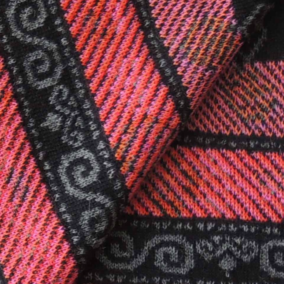 Ruana, wrap, baby alpaca, jacquard knitted with embroidered floral pattern. Made in Peru by PFL knitwear Ruana, wrap, baby alpaca, jacquard knitted with embroidered floral pattern. Made in Peru by PFL knitwear