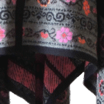Ruana, wrap, baby alpaca, jacquard knitted with embroidered floral pattern. Made in Peru by PFL knitwear Ruana, wrap, baby alpaca, jacquard knitted with embroidered floral pattern. Made in Peru by PFL knitwear