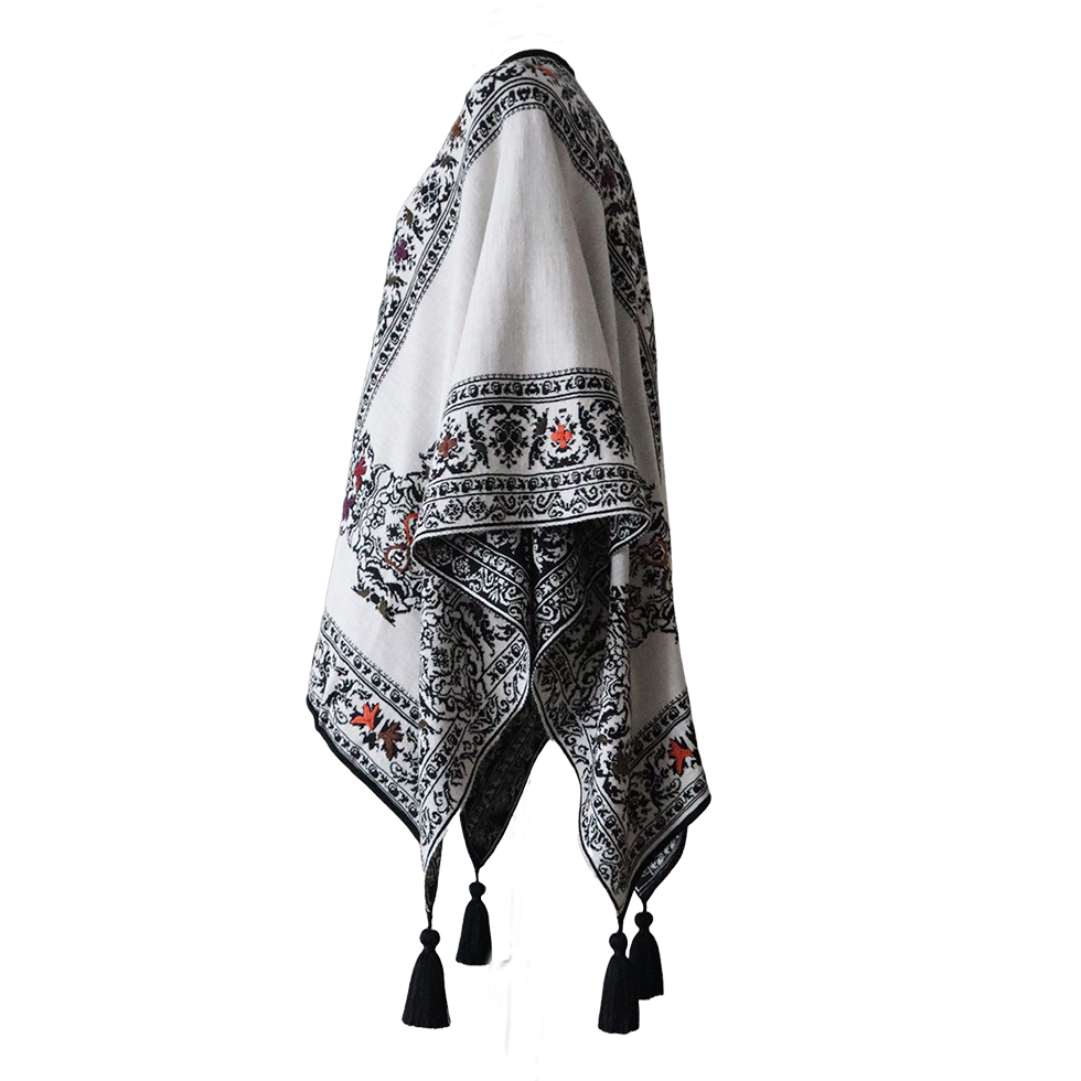 Ruana, wrap reversible, alpaca blend, jacquard knitted pattern, with tassels. Made in Peru by PFL knitwear Ruana, wrap reversible, alpaca blend, jacquard knitted pattern, with tassels. Made in Peru by PFL knitwear
