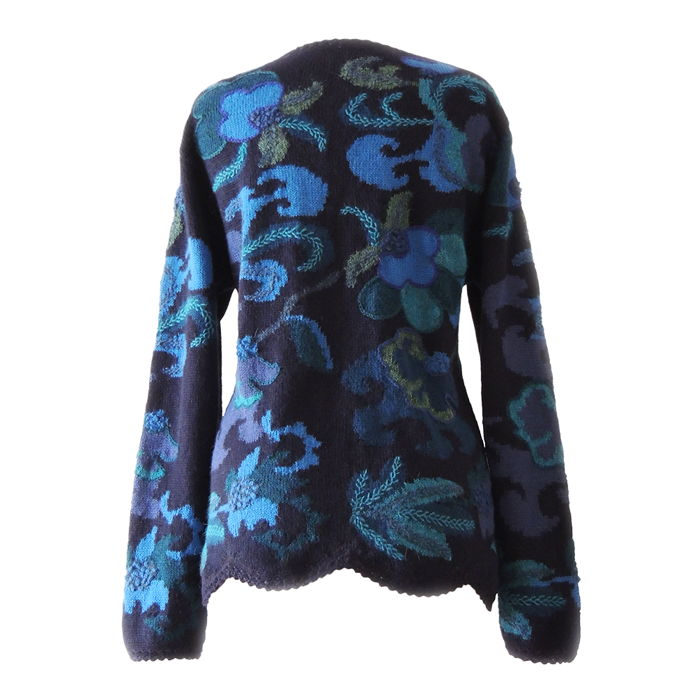 Women's alpaca cardigan Paracas, blue shades, Intarsia knitted with flower pattern. Women's alpaca cardigan Paracas, blue shades, Intarsia knitted with flower pattern.