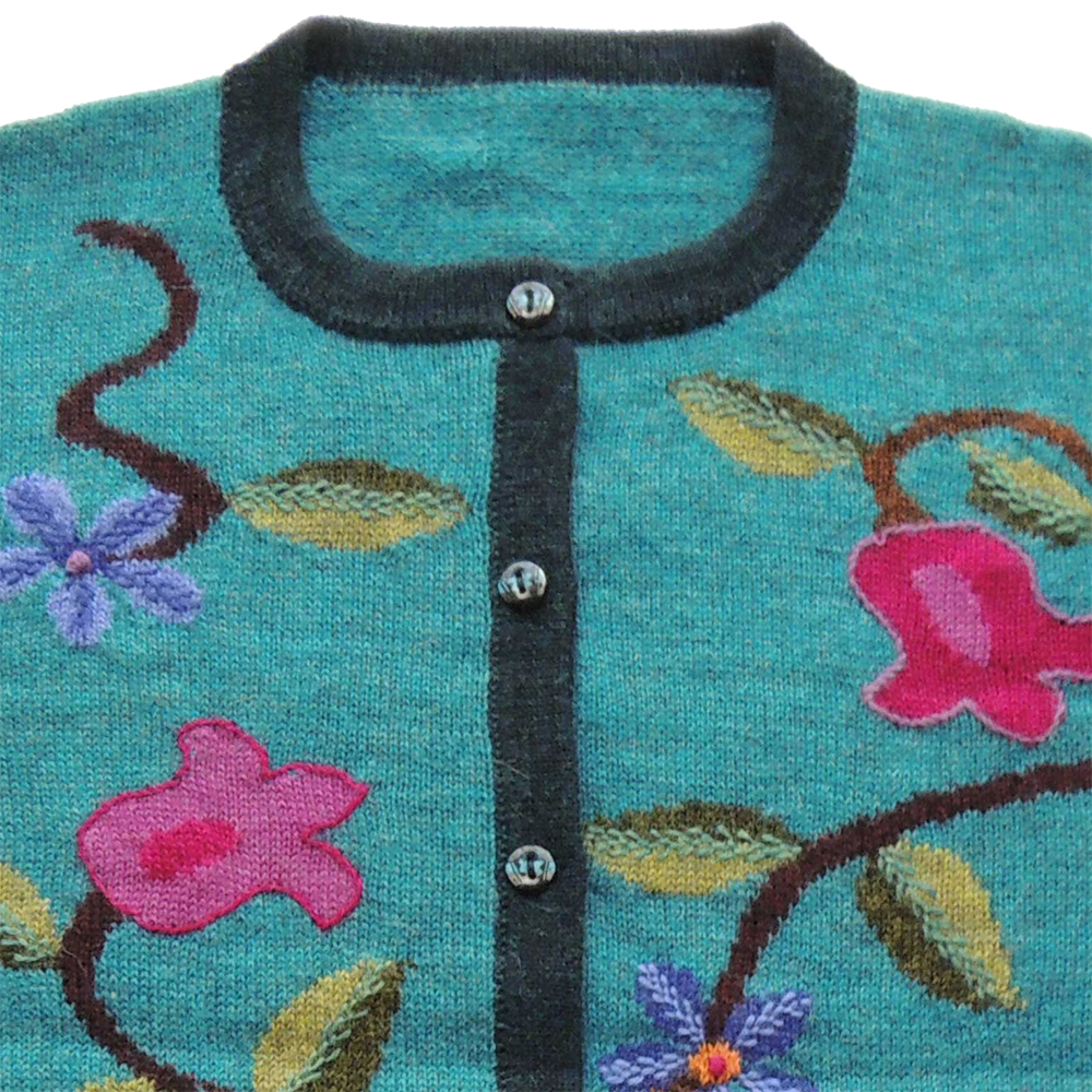 Women's alpaca cardigan Ingata, multicolor Intarsia knitted with flower pattern. Women's alpaca cardigan Ingata, multicolor Intarsia knitted with flower pattern.
