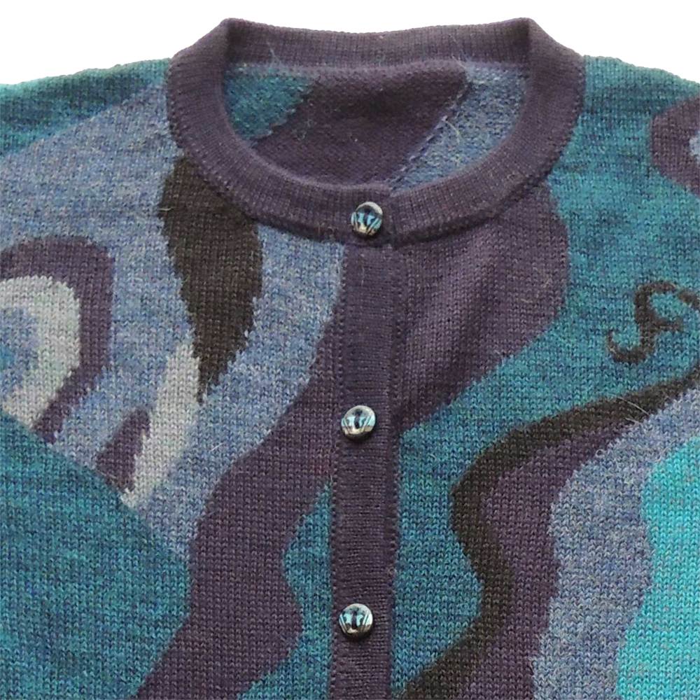 Women's alpaca cardigan Shirinta, multicolor Intarsia knitted with graphic pattern. Women's alpaca cardigan Shirinta, multicolor Intarsia knitted with graphic pattern.