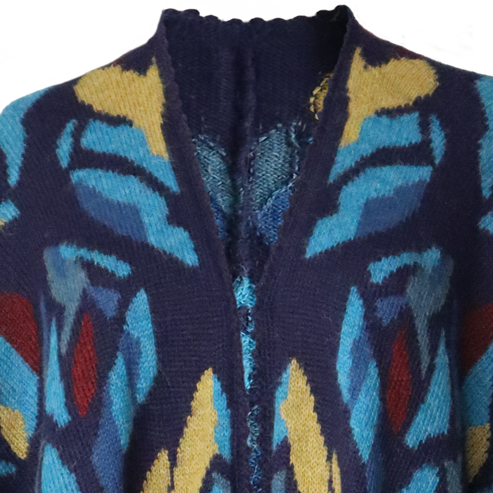PFLknitwear.com/b2b/ Alpaca Ruana Wrap Tulipan with Colorful Intarsia Pattern, hand knitted. PFLknitwear.com/b2b/ Alpaca Ruana Wrap Tulipan with Colorful Intarsia Pattern, hand knitted.