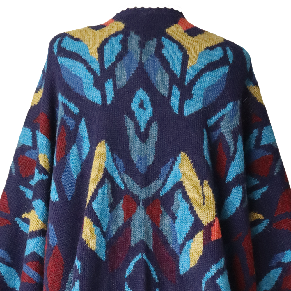 PFLknitwear.com/b2b/ Alpaca Ruana Wrap Tulipan with Colorful Intarsia Pattern, hand knitted. PFLknitwear.com/b2b/ Alpaca Ruana Wrap Tulipan with Colorful Intarsia Pattern, hand knitted.