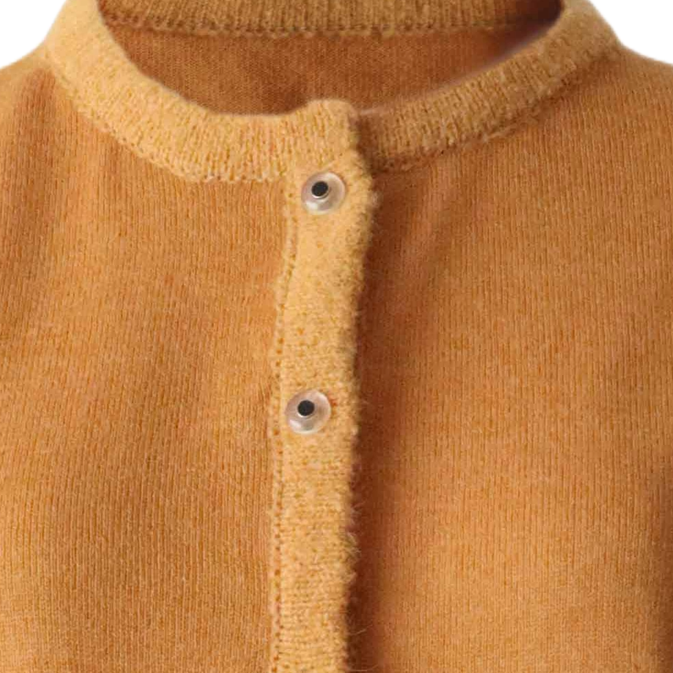 PFL knitwear Cardigan baby alpaca, vest baby alpaca with button closure and crew neck color ginger orange. PFL knitwear Cardigan baby alpaca, vest baby alpaca with button closure and crew neck color ginger orange.