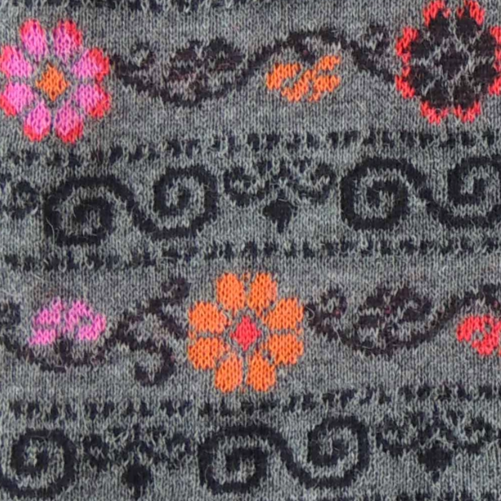 pflknitwear.com Ruana / wrap, baby alpaca, jacquard knitted with embroidered floral pattern. pflknitwear.com Ruana / wrap, baby alpaca, jacquard knitted with embroidered floral pattern.