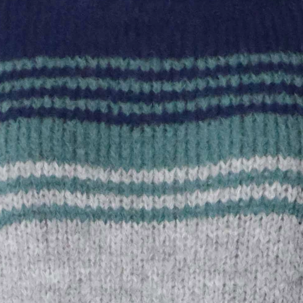 pflknitwear.com Women's sweater made from an alpaca blend yarn, with a soft brushed texture and a stripe design featuring three different colors. pflknitwear.com Women's sweater made from an alpaca blend yarn, with a soft brushed texture and a stripe design featuring three different colors.