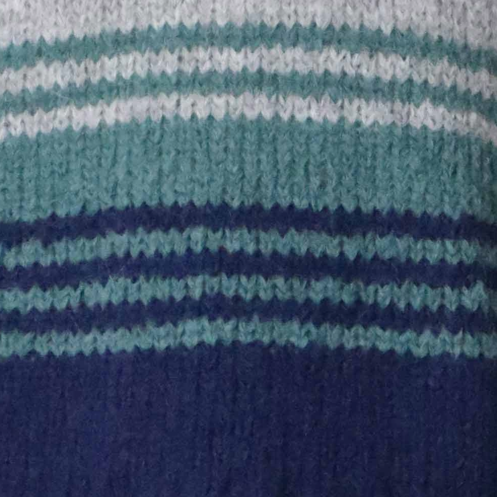 pflknitwear.com Women's sweater made from an alpaca blend yarn, with a soft brushed texture and a stripe design featuring three different colors. pflknitwear.com Women's sweater made from an alpaca blend yarn, with a soft brushed texture and a stripe design featuring three different colors.