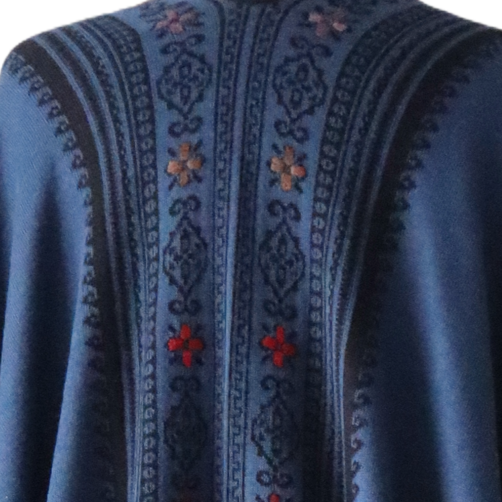 pflknitwear.com Ruana / wrap reversible, alpaca blend, jacquard knitted pattern, with tassels. pflknitwear.com Ruana / wrap reversible, alpaca blend, jacquard knitted pattern, with tassels.
