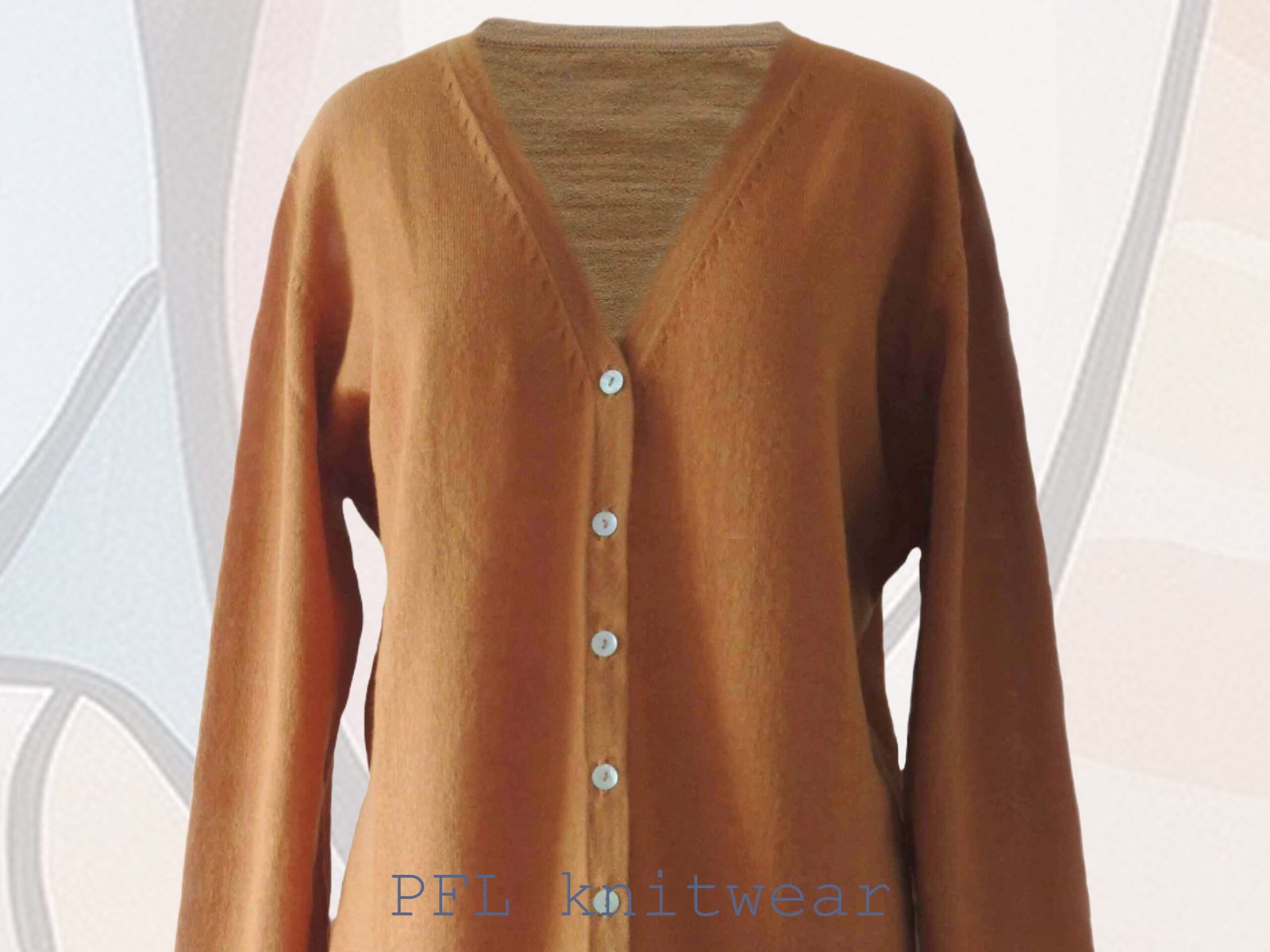 Women's cardigan baby alpaca 100%, V-neck cardigan with button closure, color sandstone orange made in Peru by PFL knitwear Women's cardigan baby alpaca 100%, V-neck cardigan with button closure, color sandstone orange made in Peru by PFL knitwear