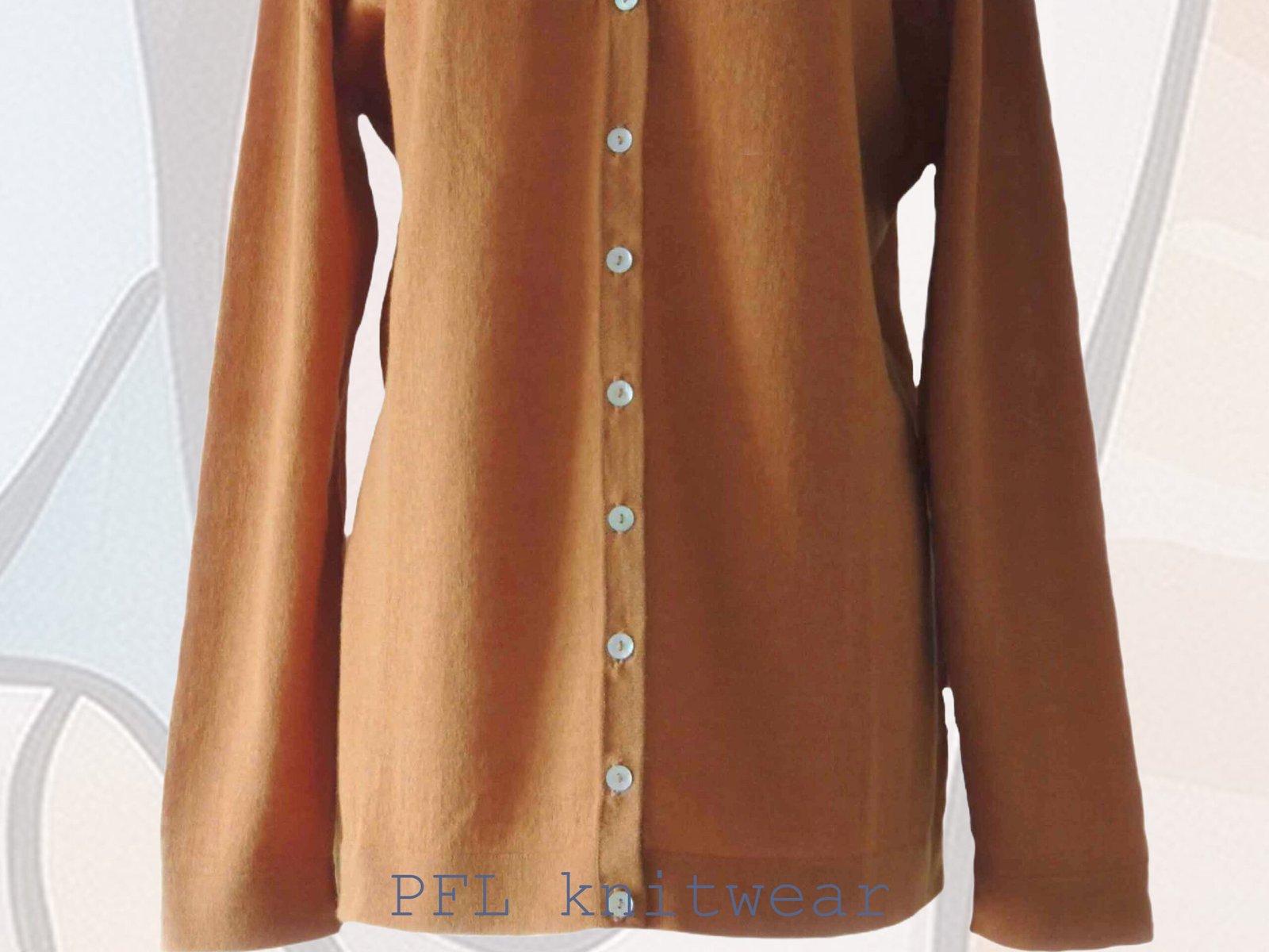 Women's cardigan baby alpaca 100%, V-neck cardigan with button closure, color sandstone orange made in Peru by PFL knitwear Women's cardigan baby alpaca 100%, V-neck cardigan with button closure, color sandstone orange made in Peru by PFL knitwear