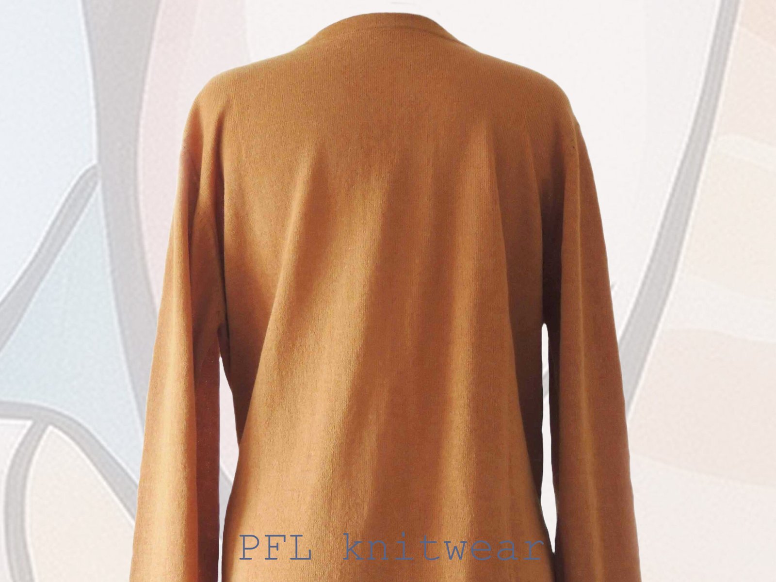 Women's cardigan baby alpaca 100%, V-neck cardigan with button closure, color sandstone orange made in Peru by PFL knitwear Women's cardigan baby alpaca 100%, V-neck cardigan with button closure, color sandstone orange made in Peru by PFL knitwear