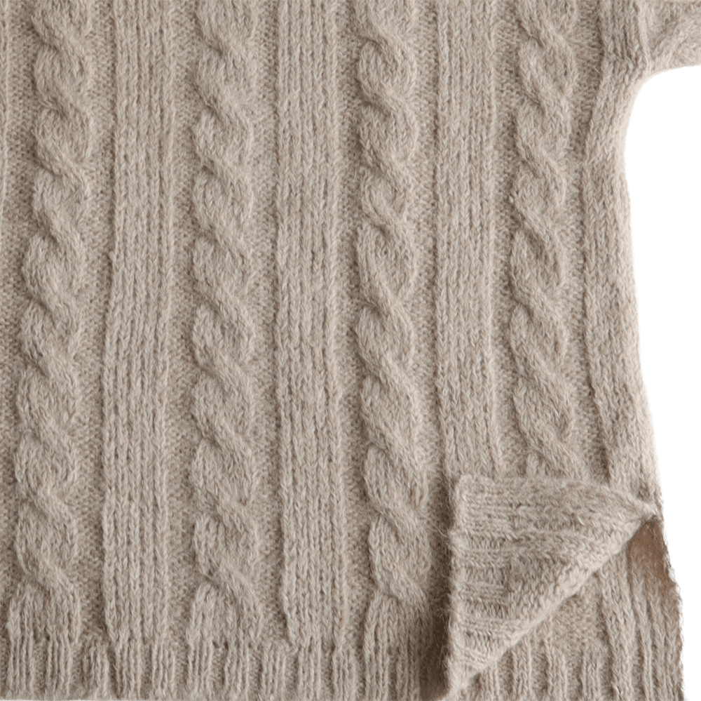 Suri Alpaca Sweater, with cable pattern side splits and crew neck, color oatmeal. Made in Peru by PFL knitwear
