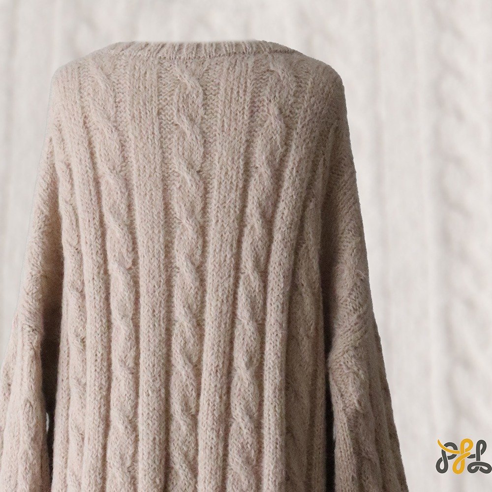 Suri Alpaca Sweater, with cable pattern side splits and crew neck, color oatmeal. Made in Peru by PFL knitwear