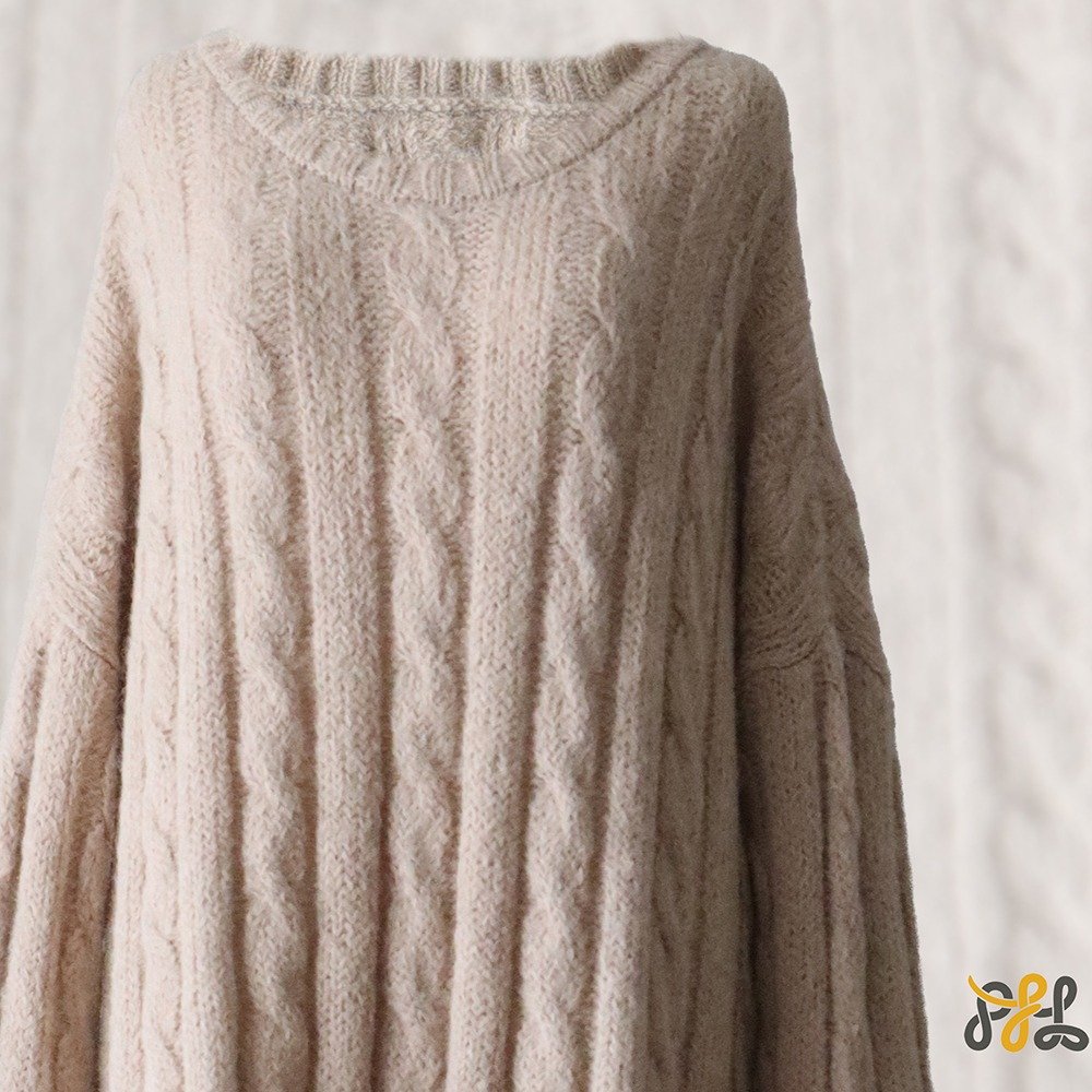 Suri Alpaca Sweater, with cable pattern side splits and crew neck, color oatmeal. Made in Peru by PFL knitwear